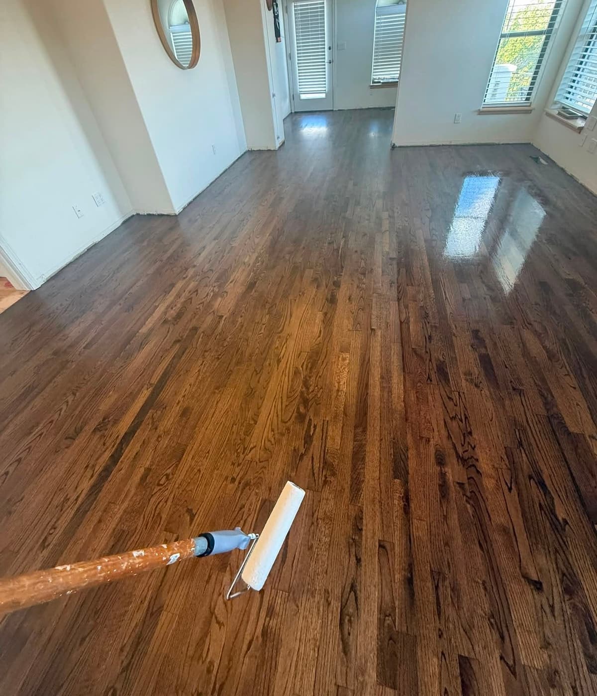 Hardwood floor after refinishing with a finish applicator