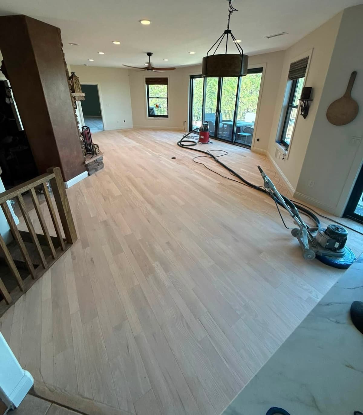 Preparing hardwood flooring by sanding
