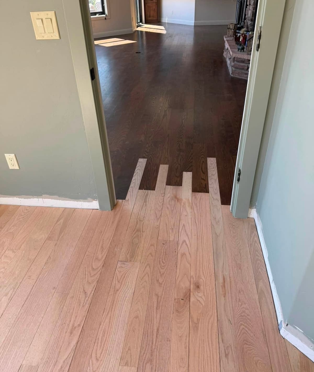 Hardwood floor transition before staining