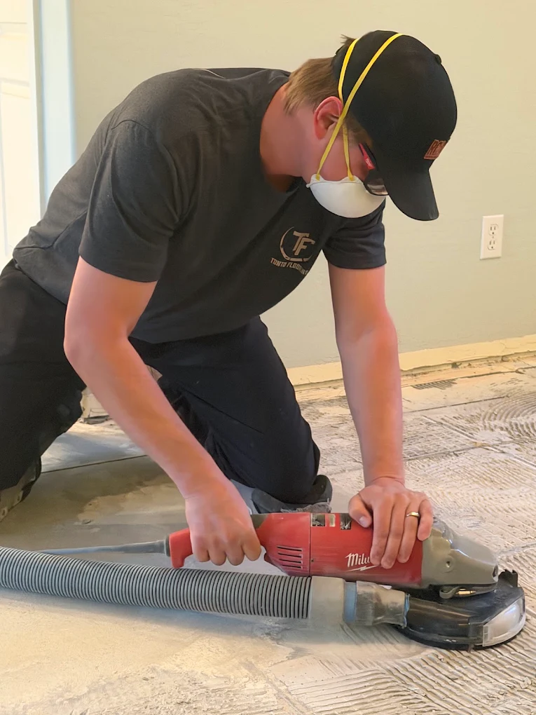Nic Creighton of Tonto Flooring sanding a hardwood floor